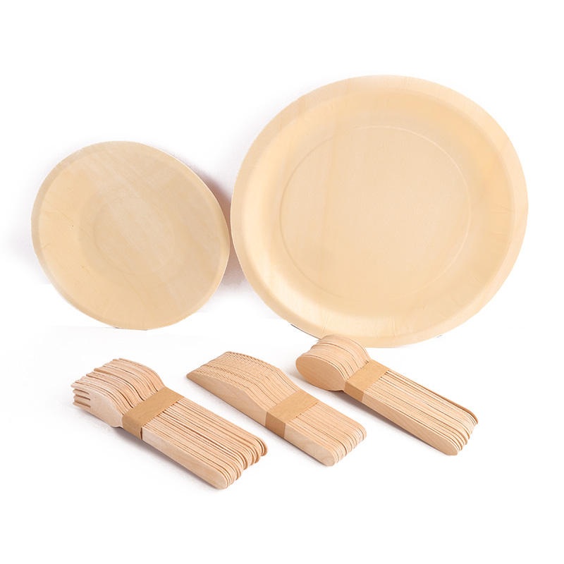 Round wooden plates with disposable wooden forks, knives and spoons